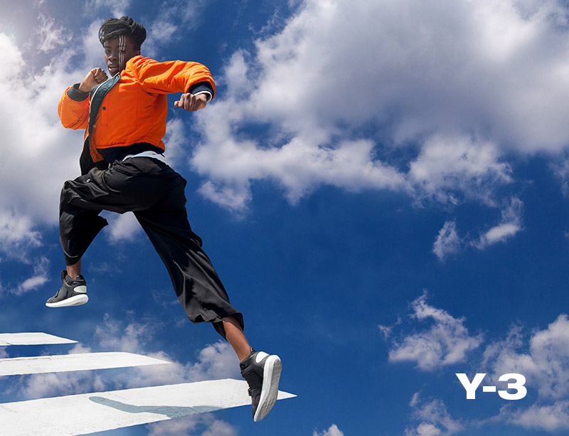 Y-3 brand campaign by Kipenkocom milan photographer like man in blue cloudy sky walking